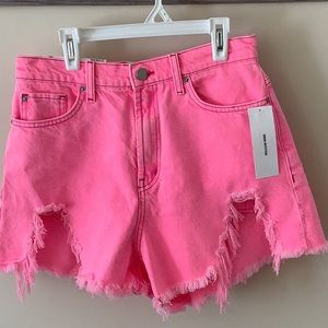 Hot pink distressed UA shorts